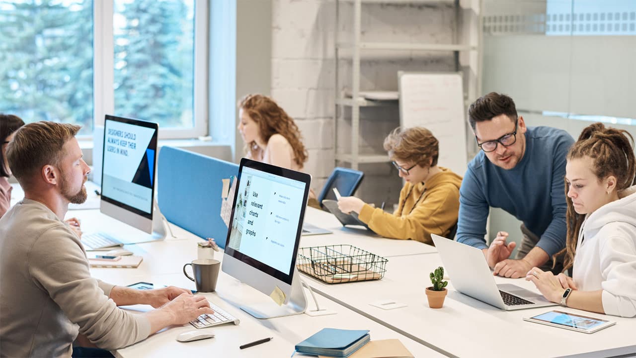 Caledonian AI team collaborating in a modern Glasgow office